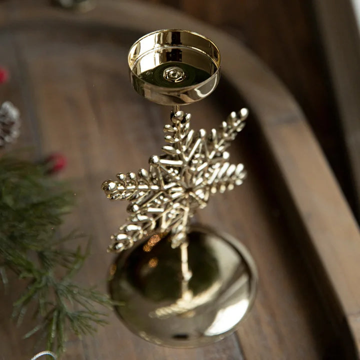 Golden Christmas candlestick with festive designs