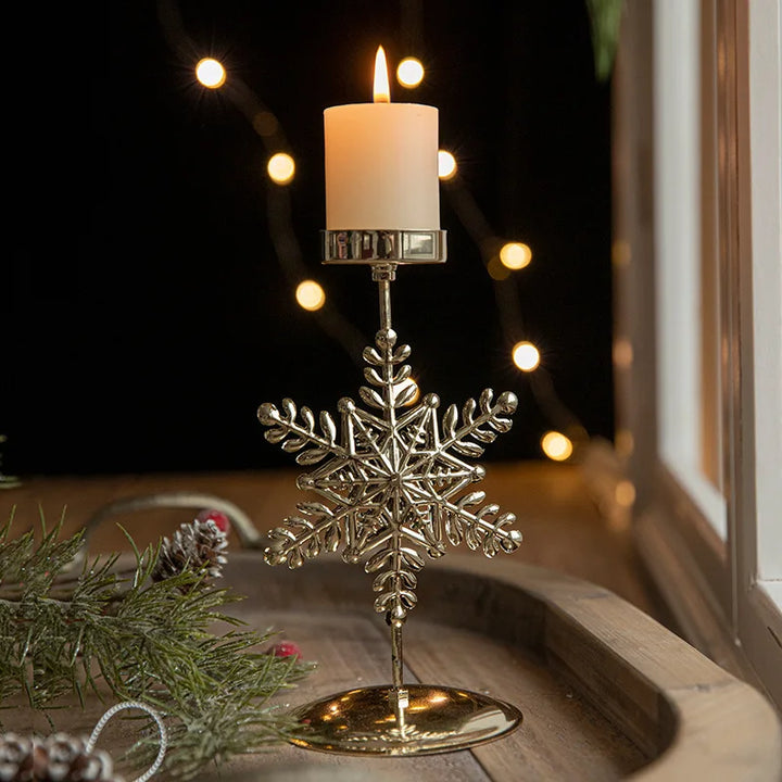 Golden Christmas candlestick with festive designs