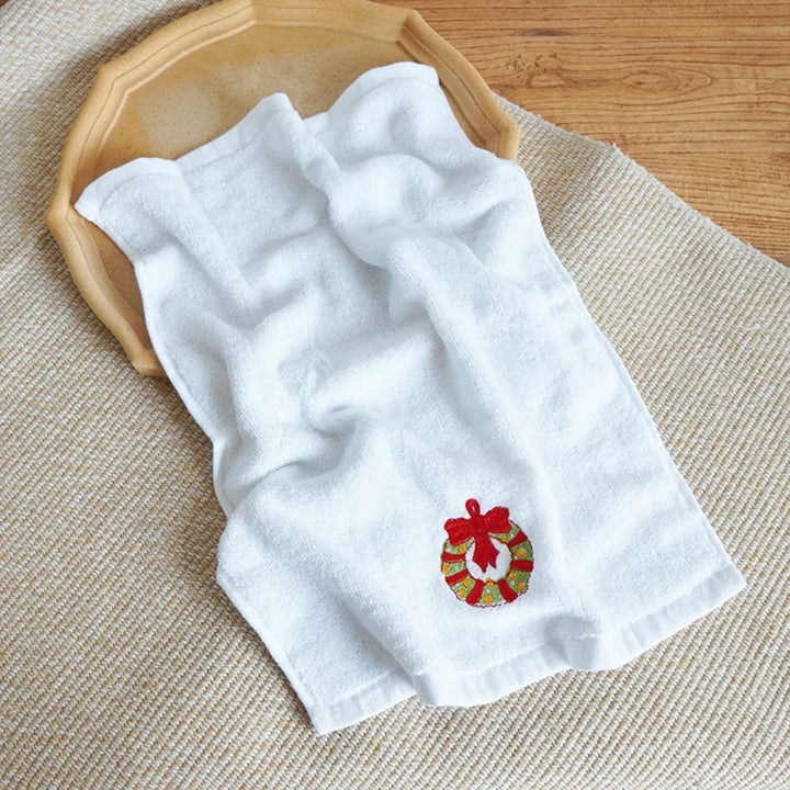 Christmas soft cotton towels in red, green, and white with holiday designs