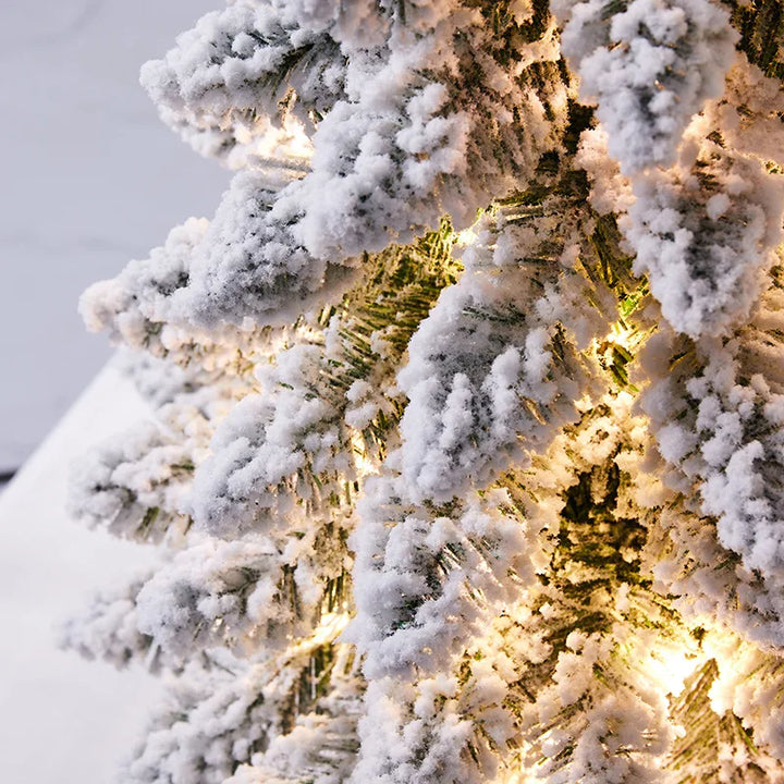 Snowy Christmas Tree with flocked branches for holiday décor